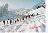 AK Ski Heil aus Badgastein. Schihaserl und Übungswiese an der Stubnerkogeltalstation mit Blick auf Radhausberg.